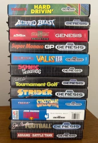 Sega Genesis 12-Game Pack w/ Strider, Sonic, etc. All w/ cases, Most w/ manuals.