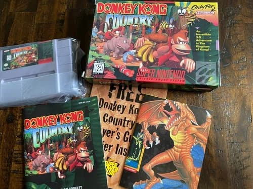 Donkey Kong Country (Super Nintendo, 1994) with box, manual, and other inserts